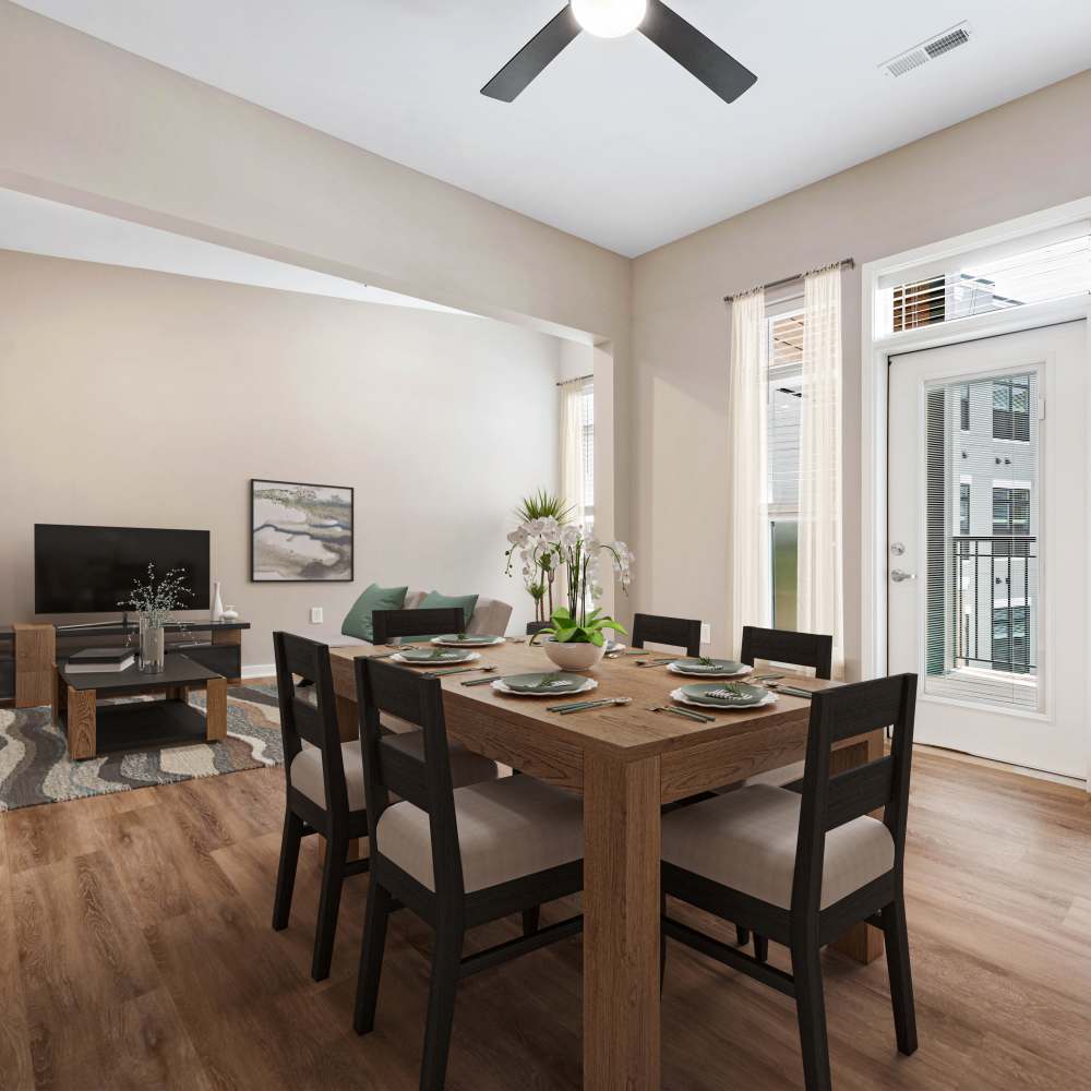 Dining area with ceiling fan and view to living room at Neo Vantage Point in Maryland Heights, Missouri