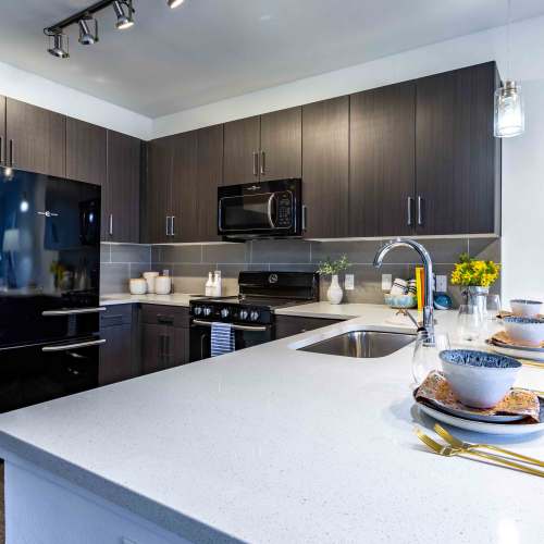 Modern kitchen with marble countertops at Art on Highland in Phoenix, Arizona