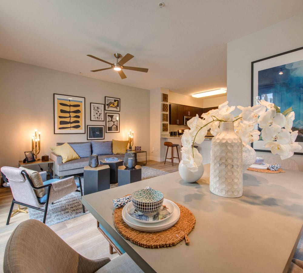 Floor to ceiling windows and a ceiling fan in a model home's living area at Sofi Warner Center in Woodland Hills, California