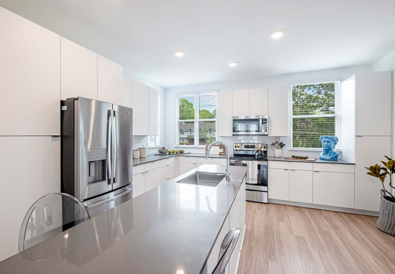 Modern kitchen with stainless-steel appliances at Saylor at Southside Trail in Atlanta, Georgia