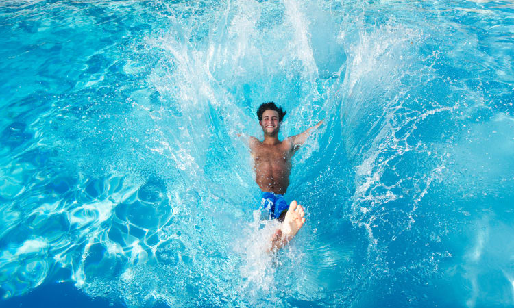 Resident enjoying the pool at Uptown Ann Arbor in Ann Arbor, Michigan