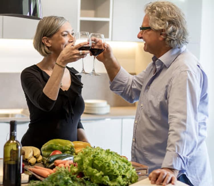 Elderly couple drinking wine at Maplewood at Southport in Southport, Connecticut