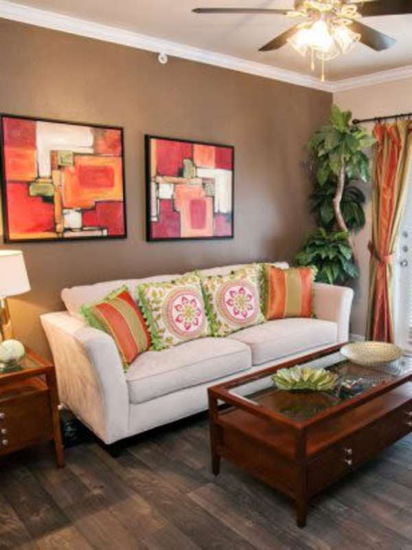Modern living room with colorful curtains and coffee table at Madison at Dell Ranch in Round Rock, Texas