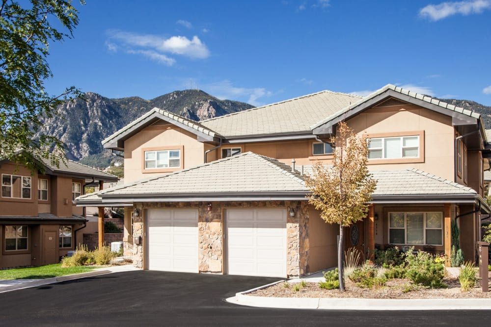 Sunny senior home with mountain in the back at The Palisades at Broadmoor Park in Colorado Springs, Colorado