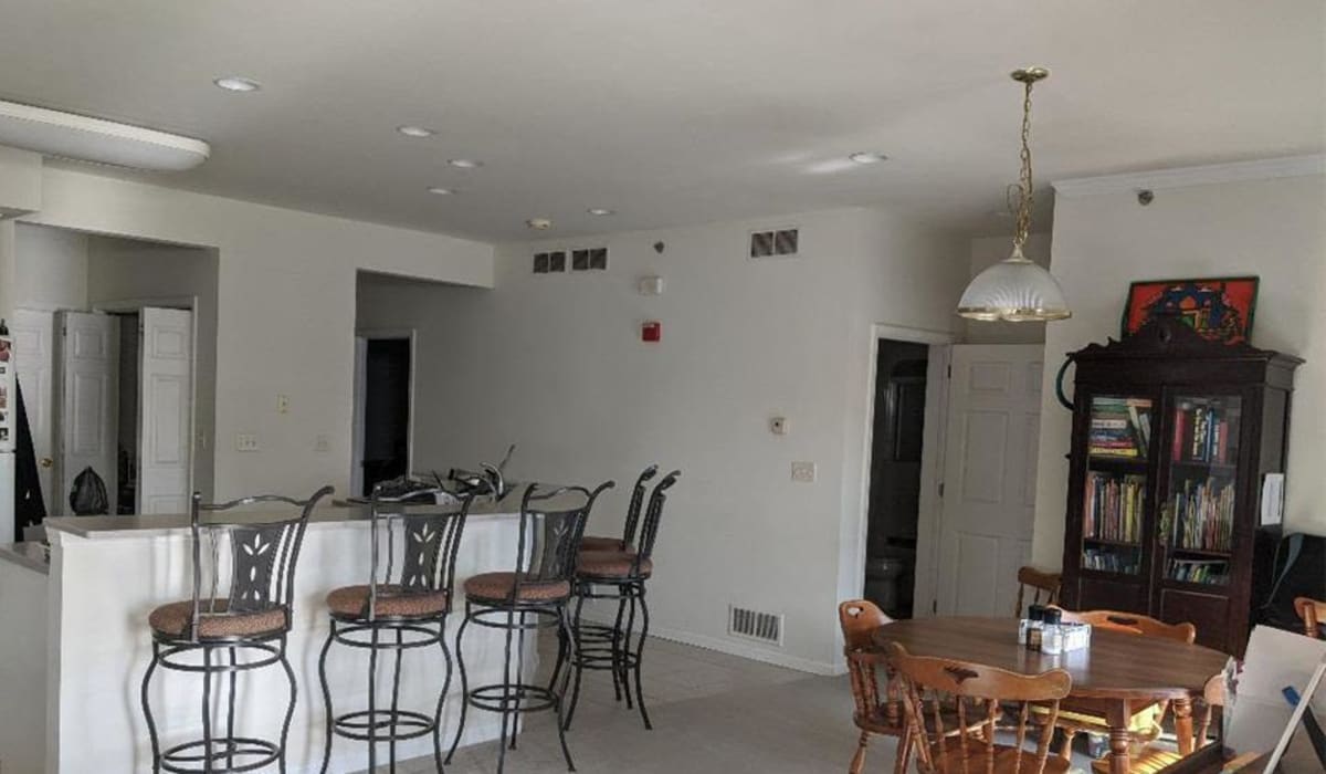 Spacious living with wall-to-wall carpeting and neutral tones at Springhouse Townhomes in Allentown, Pennsylvania