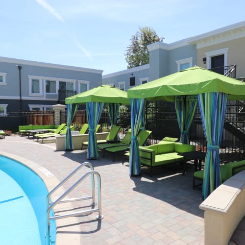 Poolside cabanas at Ramblewood Apartments in Fremont, California