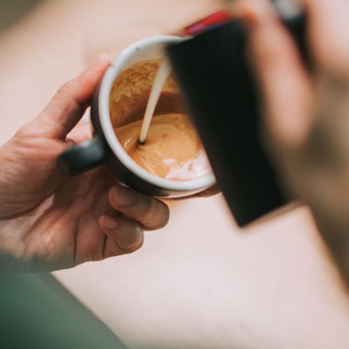 a barista pouring a shot of espresso at The Linq in Chandler, Arizona