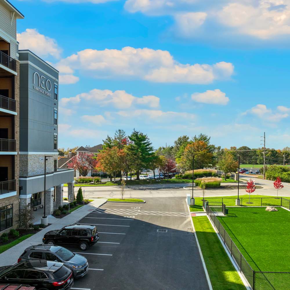 Community apartment with parked vehicle at Neo Vantage Point in Maryland Heights, Missouri