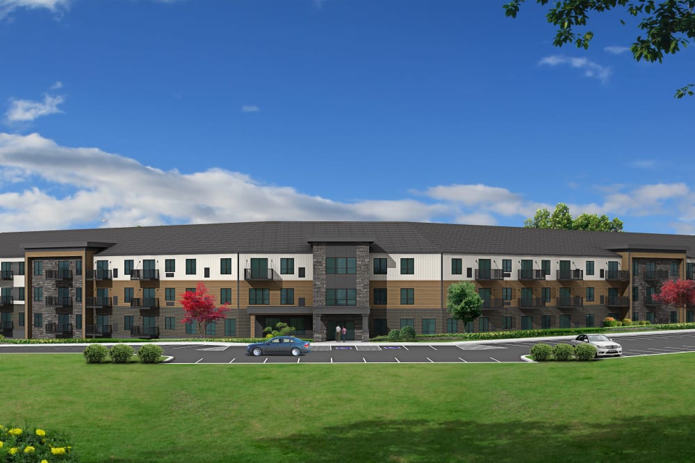Rendering of an apartment building and parking area at Vue North Apartments in Rochester, Minnesota