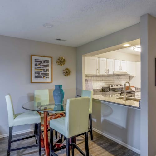 A dining room table and chairs in an apartment at Hickory Creek in Henrico, Virginia