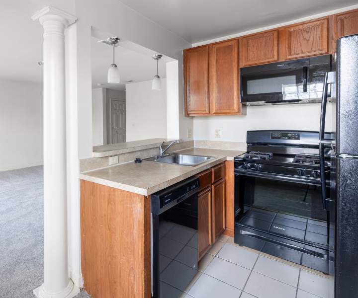 Kitchen with breakfast counter at Dundalk Village in Dundalk, Maryland   