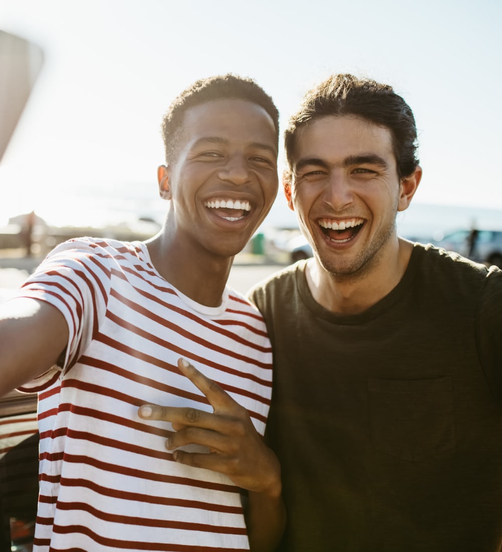 Students posing for a selfie outside of Kansas State University near The Gramercy in Manhattan, Kansas