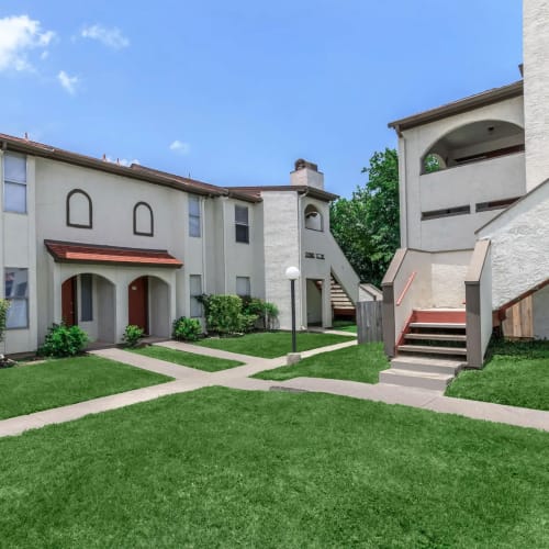 Green grass between walkways at Villas de Toscana in San Antonio, Texas