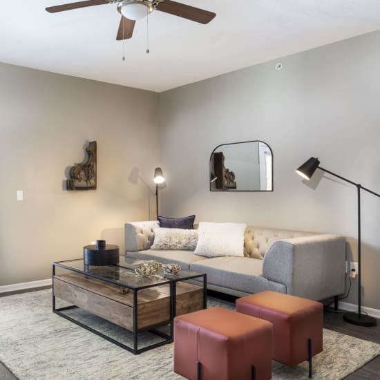 Modern living room with beautiful hardwood floors at Springhill Apartments in Overland Park, Kansas