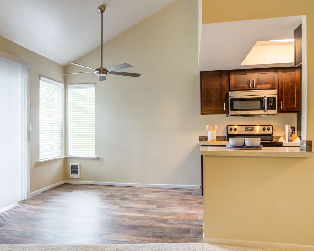 Ample natural light in a model home's kitchen and dining areas at Sofi Lake Oswego in Lake Oswego, Oregon