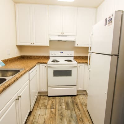 White cabinets in a kitchen at Beech St. Knolls in San Diego, California