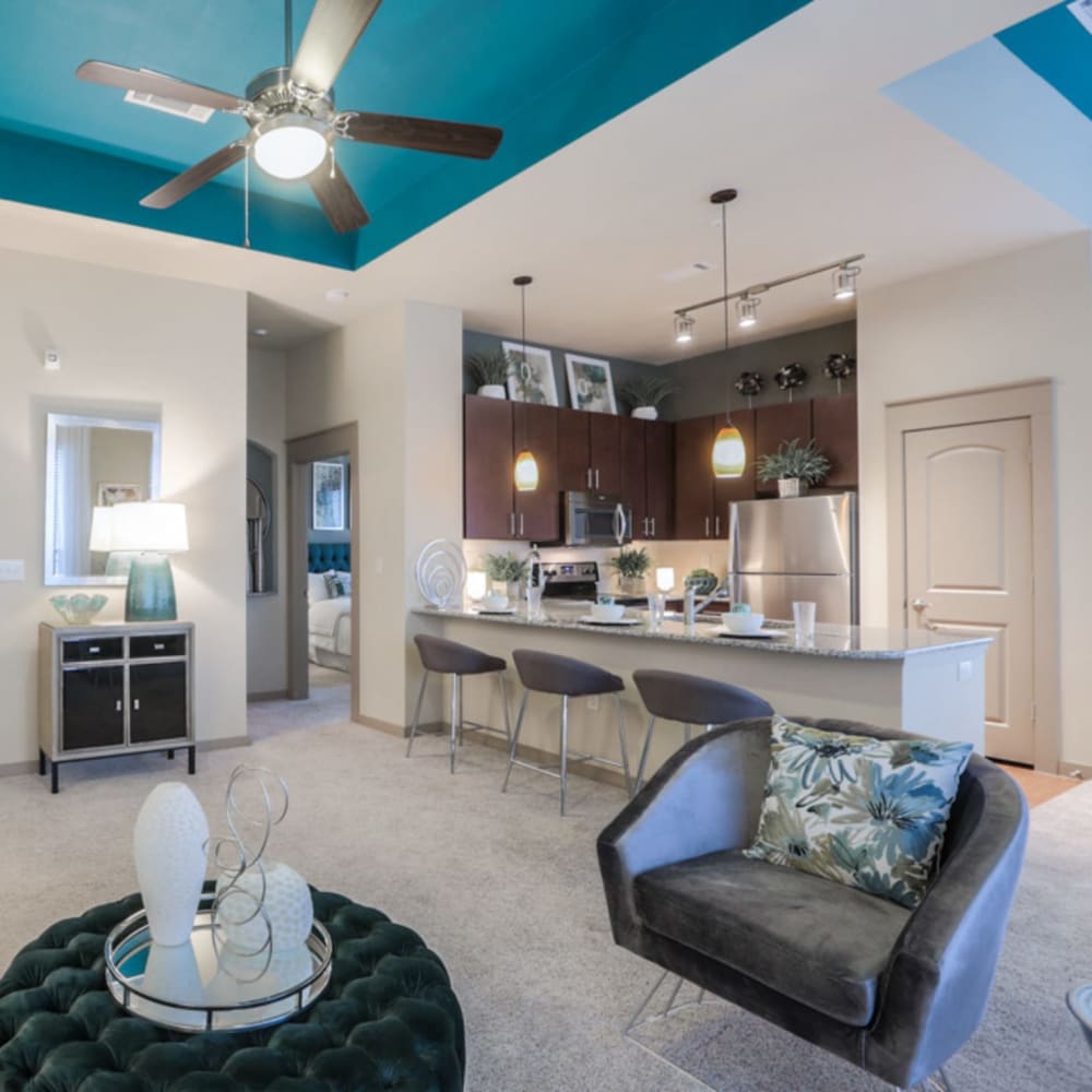 Spacious living room and open modern kitchen of a model home at Imperial Lofts in Sugar Land, Texas