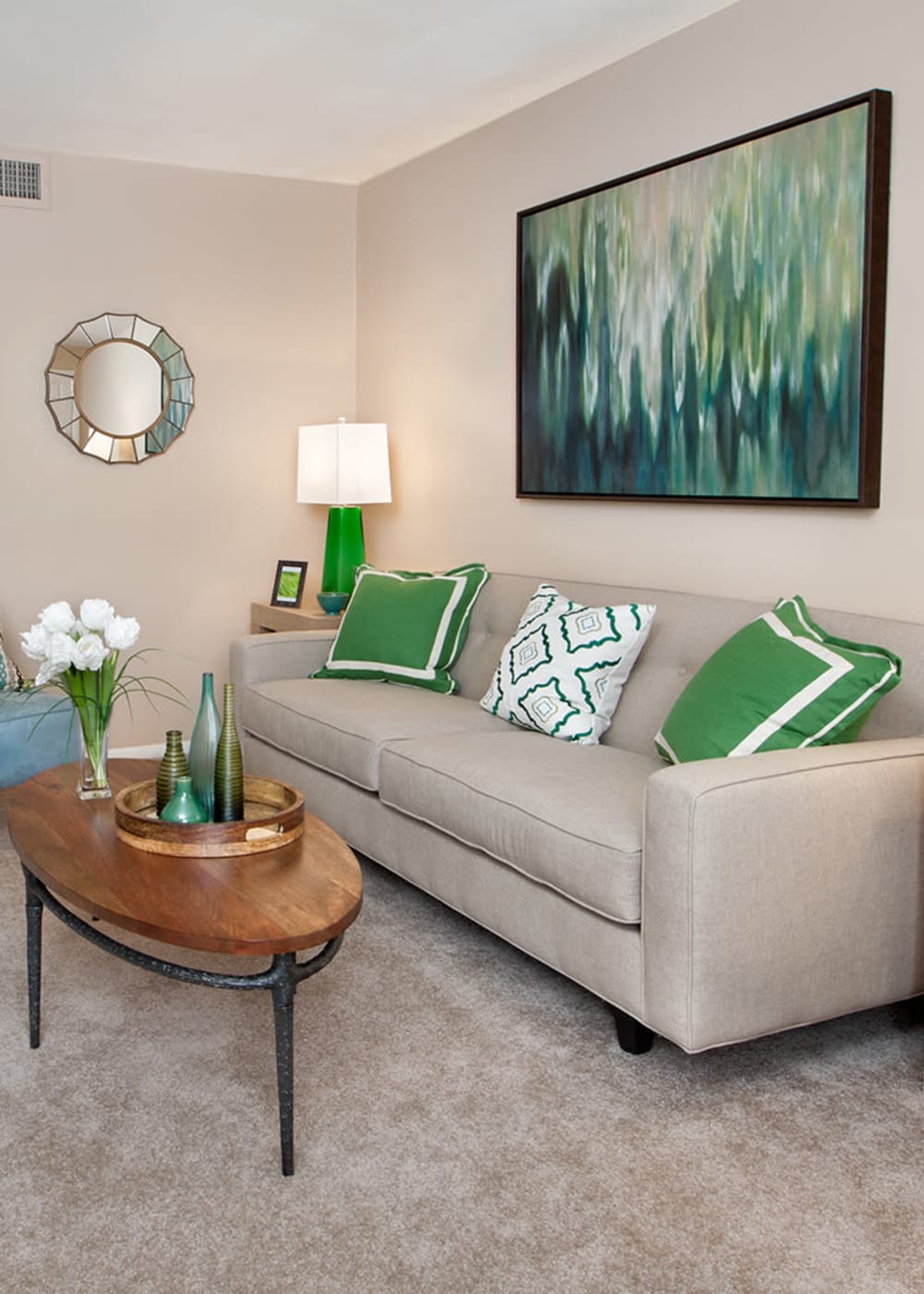 Carpeted living room of a model home at James River Pointe in Richmond, Virginia