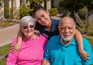 Two residents with there caretaker at Summerfield Senior Living in Bradenton, Florida