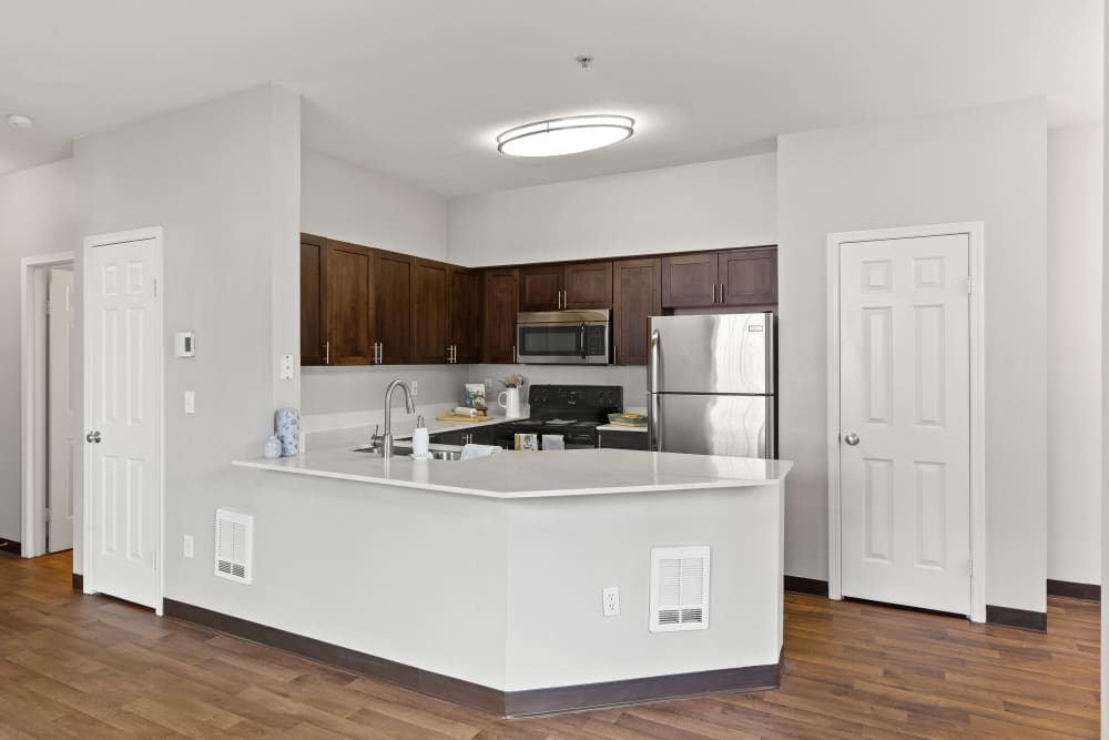 Bright dining room and kitchen at Wildreed Apartments in Everett, Washington