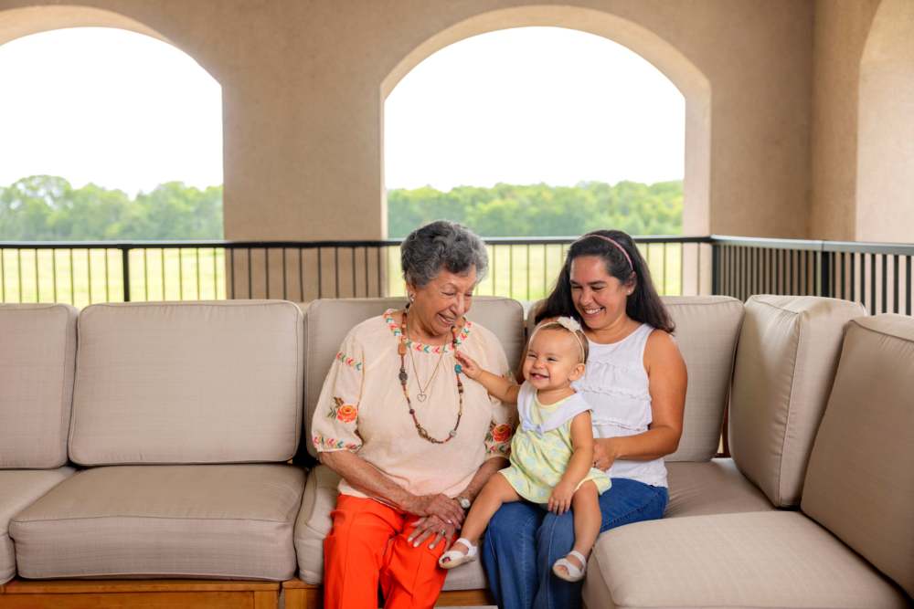 Resident with younger family members at Deepwood Estates in Lexington, South Carolina