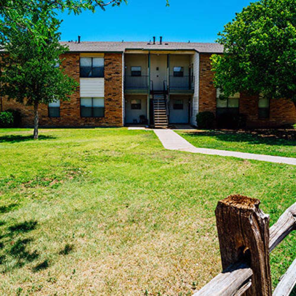 Community apartment with green lawn at Cross Timbers At Grand Street in Amarillo, Texas
