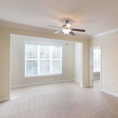 Unfurnished bedroom with a window at Seasons at Poplar Tent in Concord, North Carolina