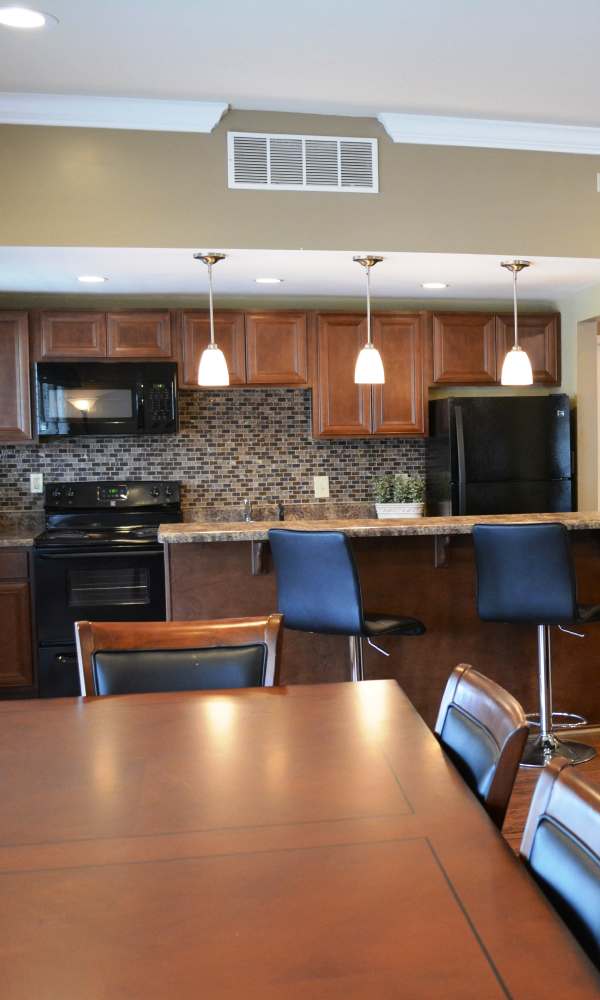 Clubhouse kitchen and dining area at The Abbey at Riverchase in Hoover, Alabama