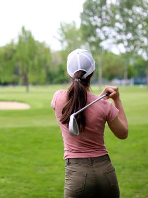 Resident golfing near City Limits Apartments in Columbia, Tennessee