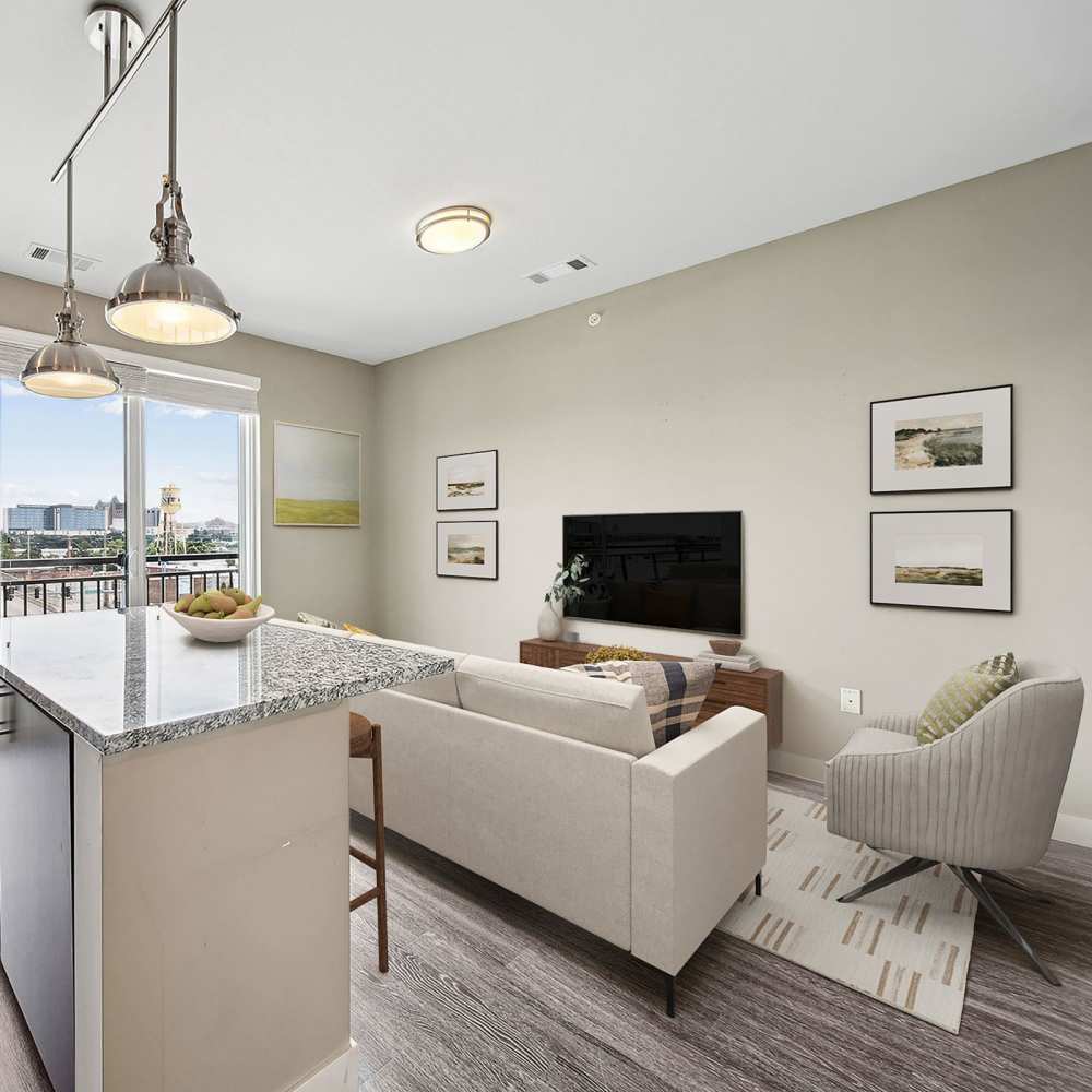 Living area with comfortable seating beside the kitchen at Chroma in Saint Louis, Missouri