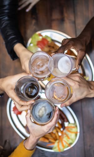 Residents having a beer celebrating their new home at The Majestic at Hewitt in Hewitt, Texas