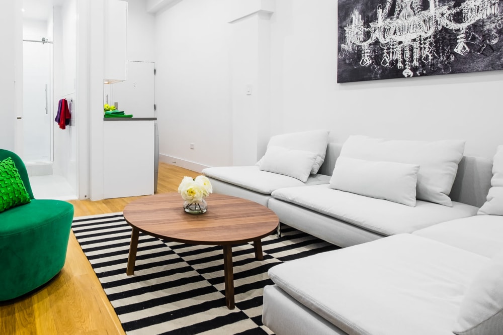 Living room with wood-style flooring at 210-220 E. 22nd Street in New York, New York