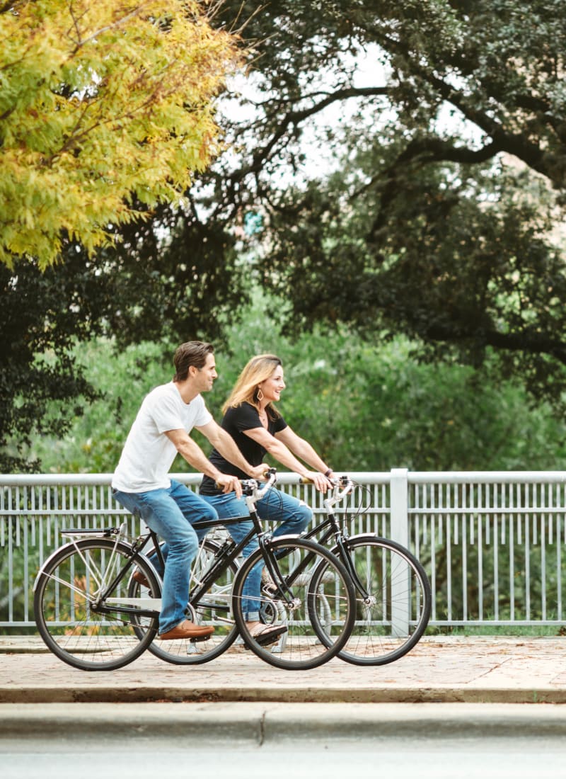 Residents riding bikes in Kingwood, Texas from Marquis at Kingwood