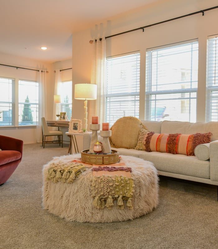 Spacious living room with large windows at 97@ North Oak in Kansas City, Missouri