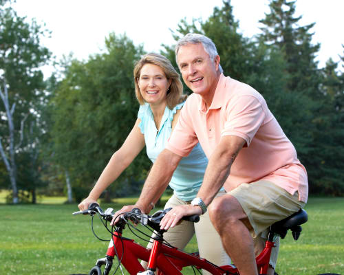 Happy senior couple on bicycles