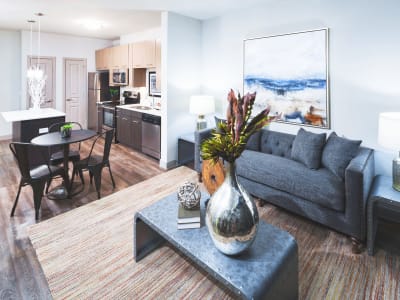 Living room of a model home with hardwood-style floors at Anatole at the Pines in Conroe, Texas