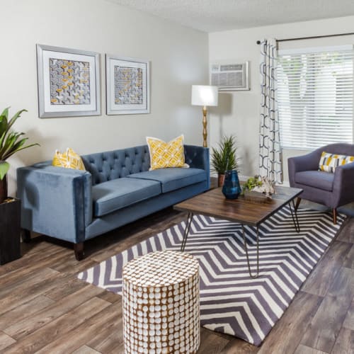 Wood-style flooring in an apartment living room at Park Regency Club Apartments in Downey, California