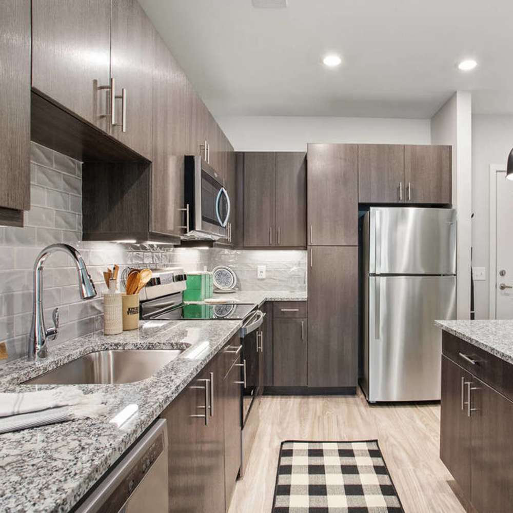 Luxury kitchen with granite countertops at The Reid in Tucker, Georgia