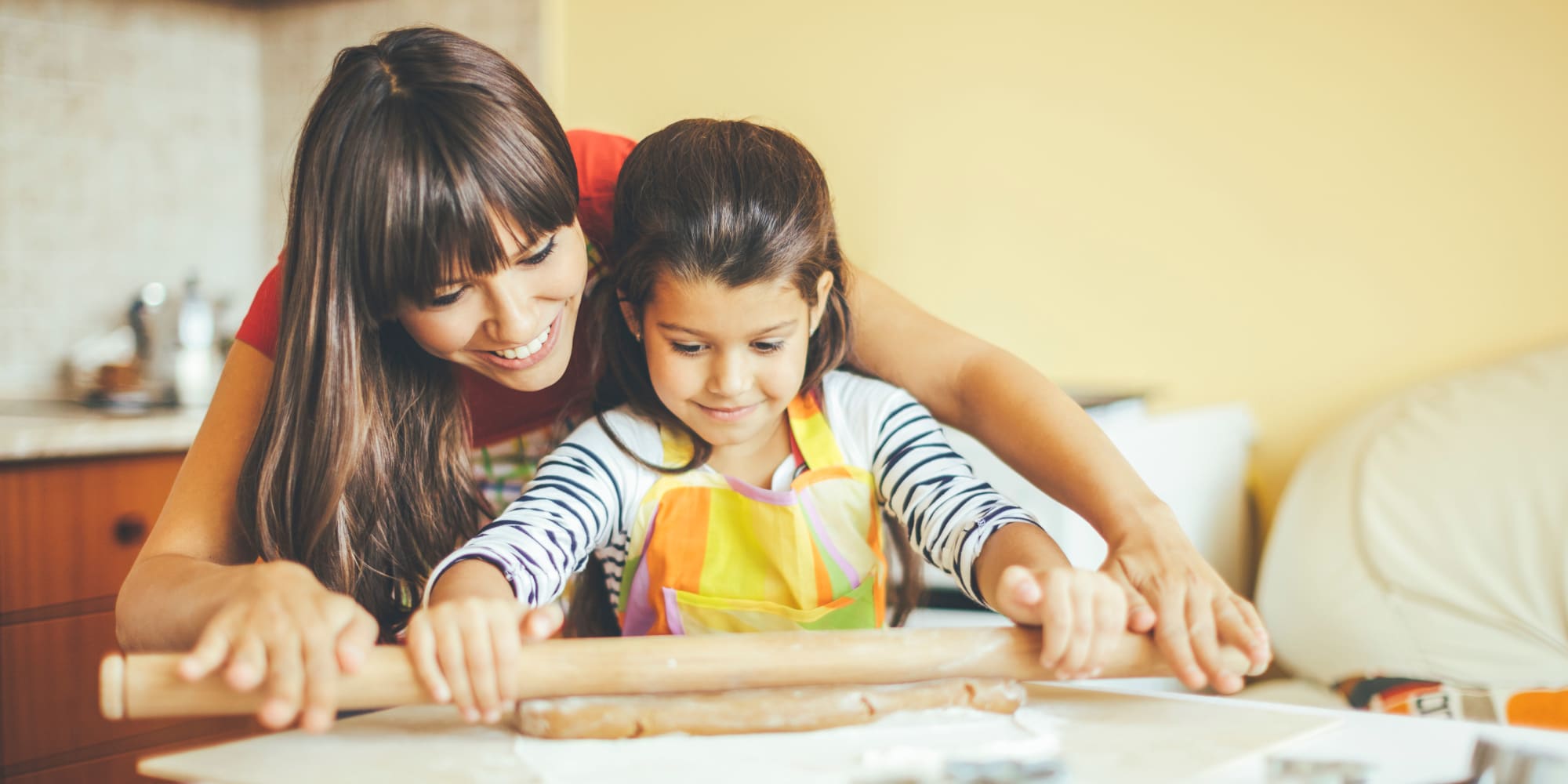 A mother and daughter baking in their home at Paragon Apartments in Lawton, Oklahoma