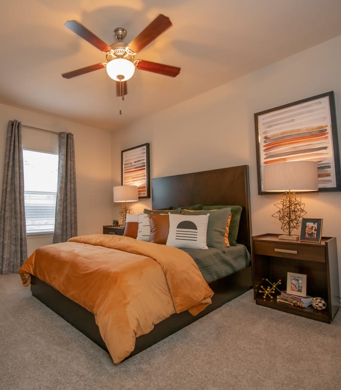 Chic bedroom with ceiling fan at Cedar Ridge in Tulsa, Oklahoma