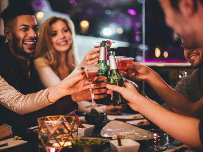 Residents enjoying a drink at a restaurant near Auberge of Burleson in Burleson, Texas
