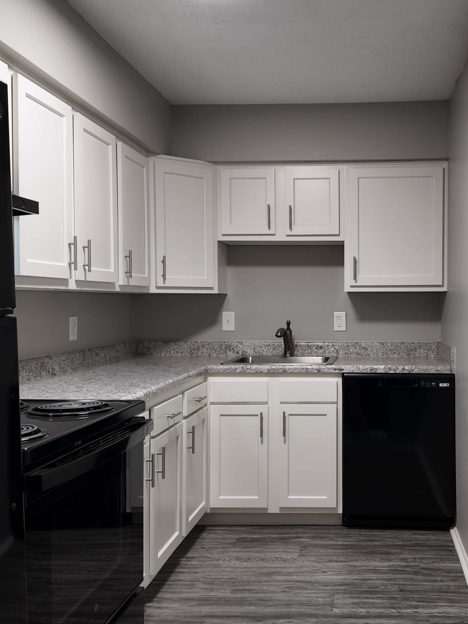 Kitchen with black appliances at Pike Place KY in Highland Heights, Kentucky