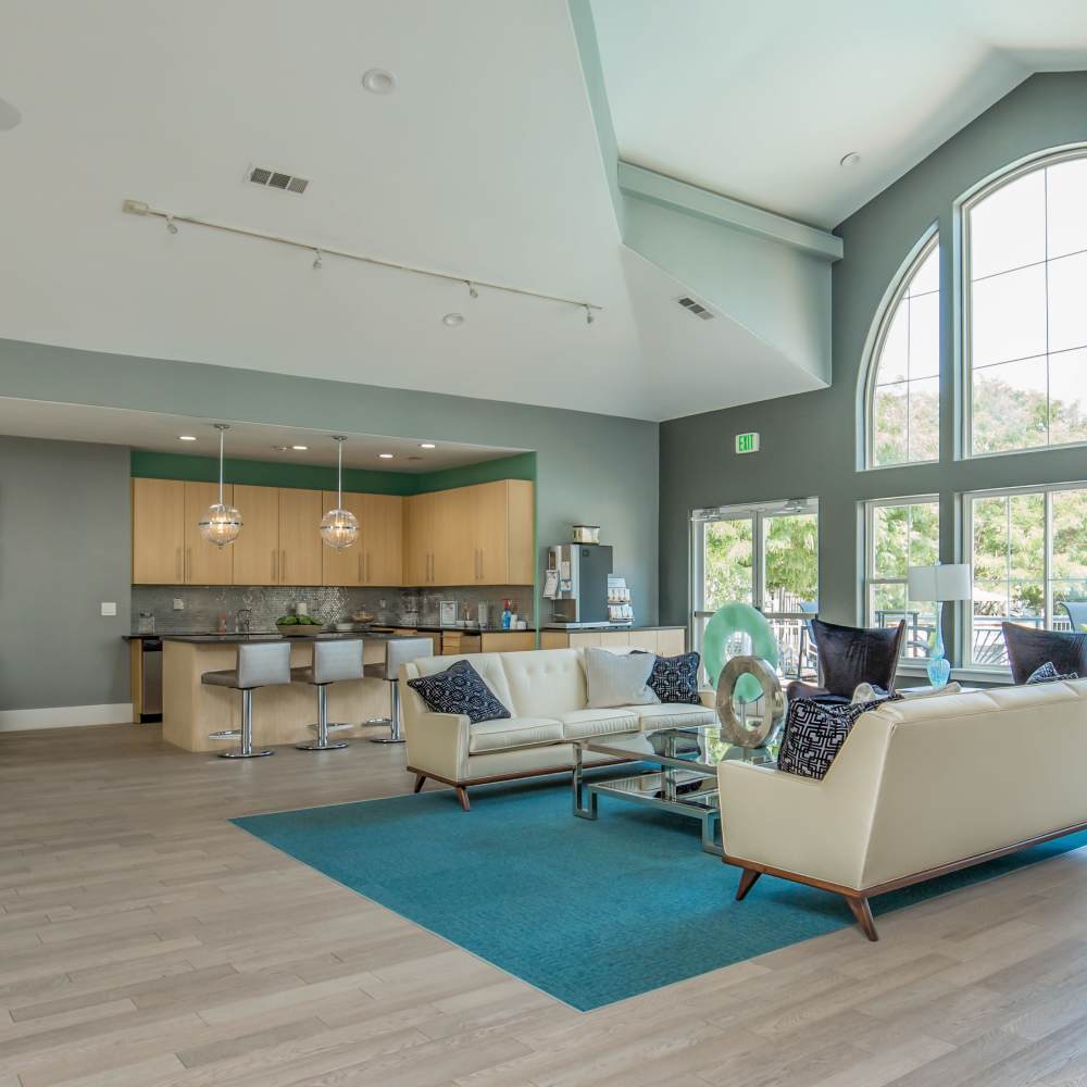 Community kitchen with lounge seating at One Belmar Place in Lakewood, Colorado