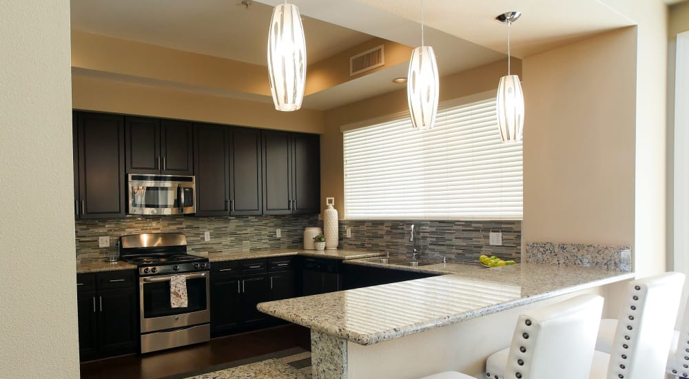 Kitchen with granite countertops at Vineyard Gate Apartments in Roseville, California