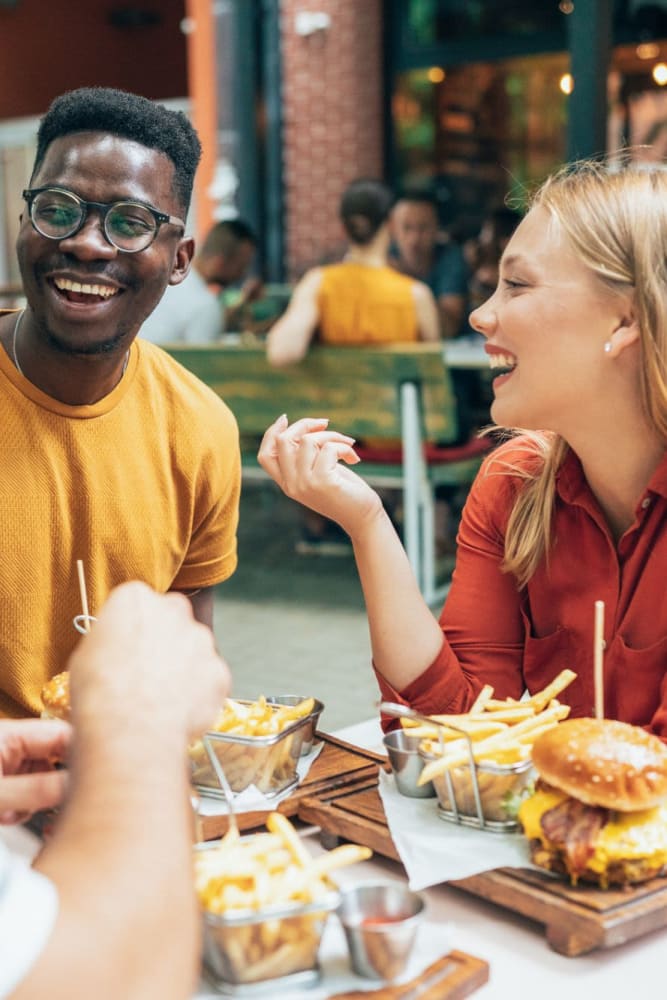 Residents dining at a local restaurant near Lakeshore Apartment Homes in Evansville, Indiana