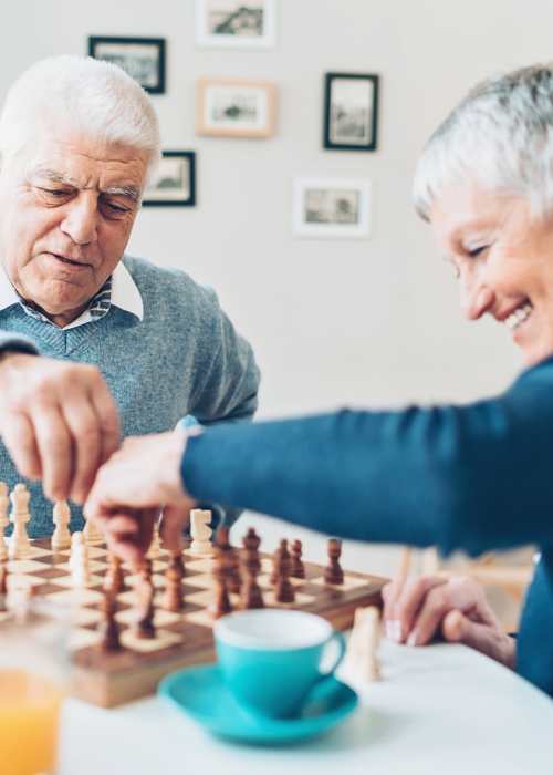 Residents playing chess at Grand Villa of Port Charlotte in Port Charlotte, Florida