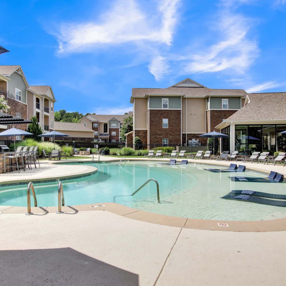 Swimming pool with sundeck seating at Chenal Pointe at the Divide in Little Rock, Arkansas