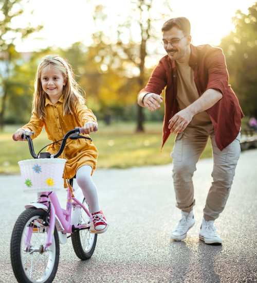 Resident with her kid in the neighborhood near Dunbar Apartments in Lexington, North Carolina