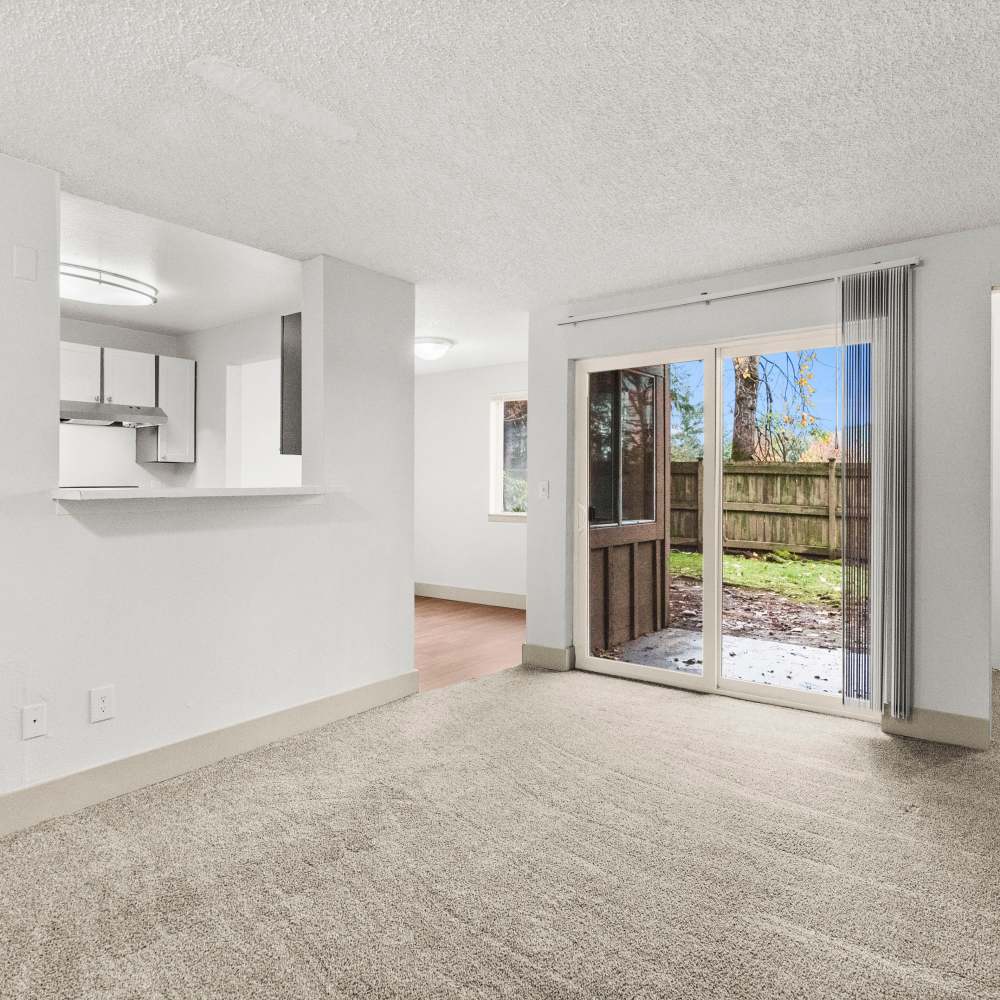 Living room with way to patio at Lodge at Madrona Ridge in Tacoma, Washington