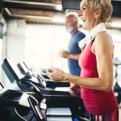 Resident exercising in the fitness center at Bidwell Park Fremont in Fremont, California